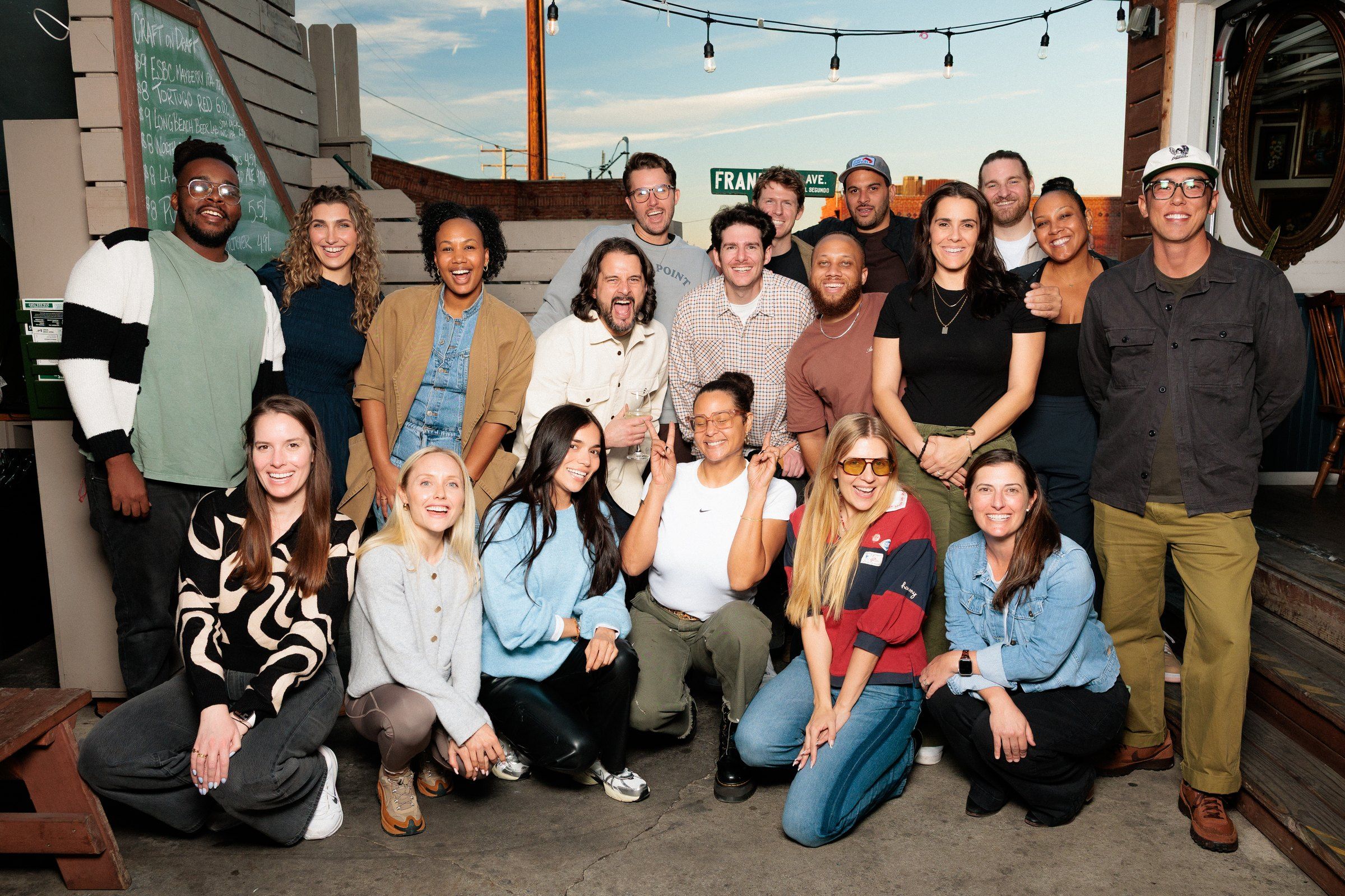 The Bench team together on an open-air patio.